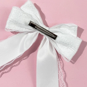 Elegant white lace bow hair clip with long satin ribbons and secure metal alligator clip