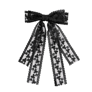 Elegante fermaglio per capelli con fiocco in pizzo nero e lunghi nastri con decori floreali