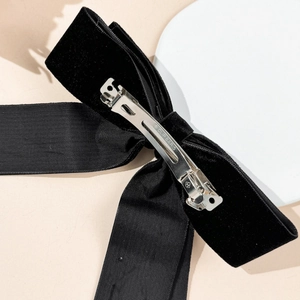 Elegant double-layer black velvet bow hair clip with a silver metal spring back fastener