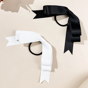 Elegant satin triple bow hair ties set in black and white for stylish high ponytails