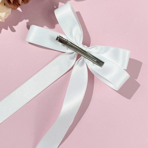 Elegant white satin ballet style hair clip with long ribbons and metal duckbill clip