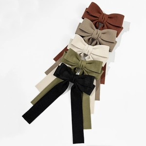 Elegant bow hair clips set in five colors with long ribbons and textured fabric