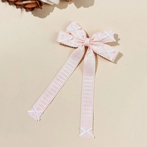 Barrette à cheveux avec nœud pied-de-poule rose et longs rubans élégants