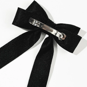 Elegant black velvet bow hair clip with a sturdy metal spring clasp for women