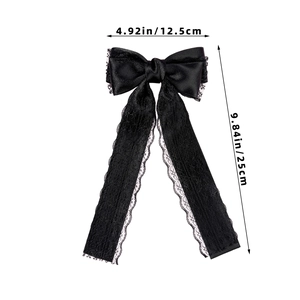 Detail showing dimensions of black lace bow hair clip with 25cm long satin ribbons