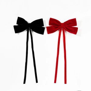 Elegant velvet bow hair clips in red and black colors with long dangling ribbons