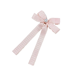 Barrette à cheveux rose avec nœud à motif pied-de-poule et détail perle