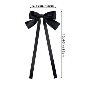 Detail view of a black satin ribbon bow hair clip with 32cm long streamers and dimensions