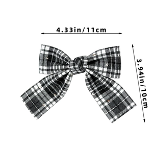 Detail of plaid bow hair clip with sequins showing dimensions of 11cm by 10cm