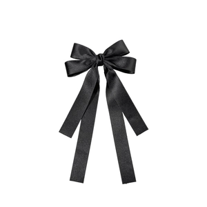 Elegant black satin bow hair clip with long streamers for a minimalist stylish look