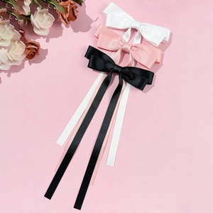 Set di fermagli per capelli con fiocco in raso nei colori bianco, rosa e nero