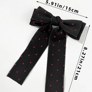 Detailed view of large black and red polka dot bow hair clip with ribbons 15x21cm