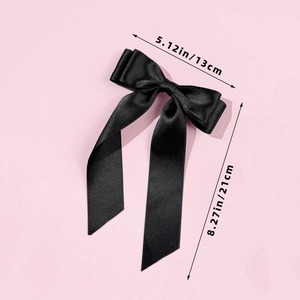 Detailed view of black satin bow hair clip with size dimensions 13cm by 21cm