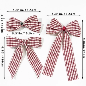 Detailed size measurement showing red and white plaid bow hair clips with long ribbons