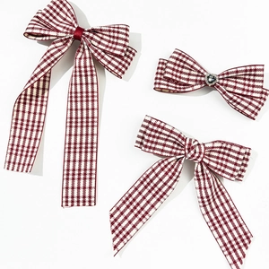 Three-piece set of red and white plaid bow hair clips with silver heart rhinestone detail