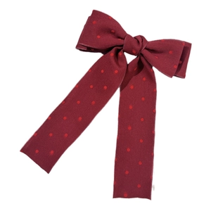 Elegant wine red polka dot bow hair clip with long ribbons for a sweet vintage style