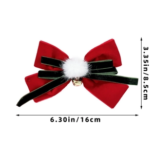 Detail showing red and green velvet bow hair clip with bell and size markings