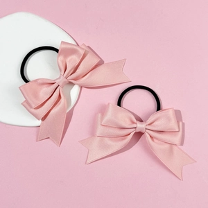 Set of two sweet pink satin ribbon bow hair ties with elastic bands for elegant styling