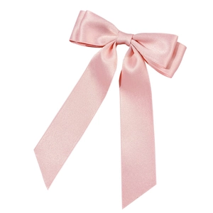 Elegant pink satin bow hair clip with long ribbons for women on a white background