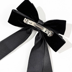 Elegant black velvet double bow hair clip with long satin ribbons and metal spring clip