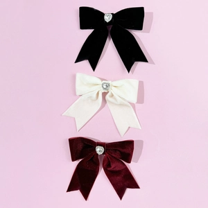 Three velvet bow hair clips in black, beige, and wine red with sparkling heart rhinestones