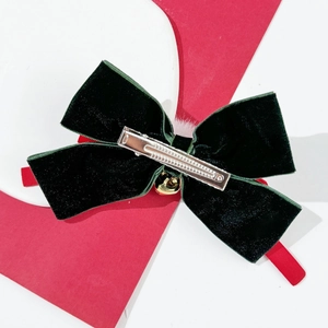 Deep green velvet bow hair clip with gold bell and silver metal duckbill clip