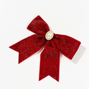 Pince à cheveux nœud en velours rouge avec paillettes argentées et perle centrale