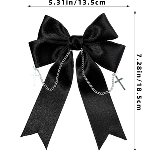 Detailed view of Gothic black satin bow hair clip with silver chains and cross charms