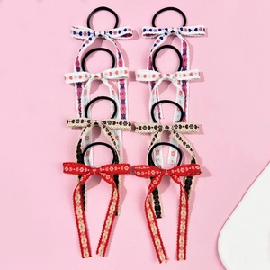 Set of 8 sweet style hair scrunchies with long lace bow streamers in floral and heart patterns