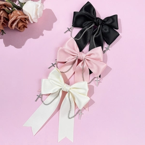 Gothic bow hair clips with silver chains and cross charms in black pink and cream