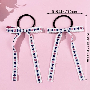 Detailed view of balletcore hair ties with heart embroidery and ribbon dimensions