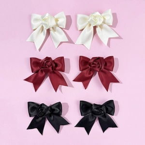 Elegant satin bow hair clips with roses in cream white, wine red, and black colors