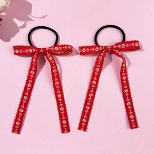 Pair of red bow hair ties with floral embroidery and long ribbons for girls