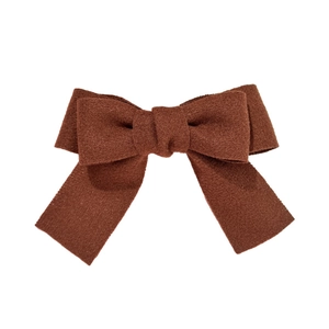 Elegant dark brown velvet bow hair clip for women with a vintage minimalist aesthetic