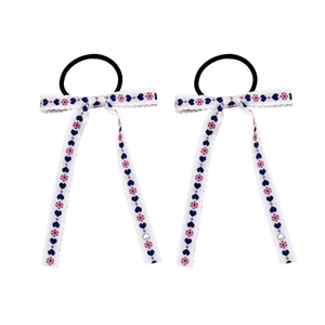 Sweet bow hair ties with embroidered hearts and floral patterns on white ribbons