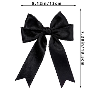 Detailed view of black satin bow hair clip with lace edges and dimension markings