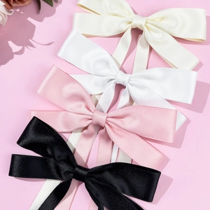 Elegant satin bow hair clips in cream white pink and black with long flowing ribbons