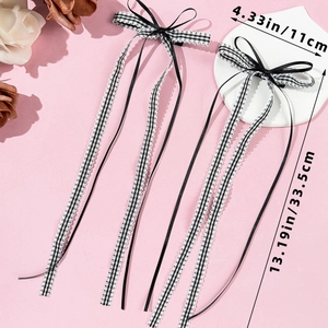 Detailed view of ballet girl plaid ribbon hair bow clips with lace edges and long streamers