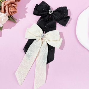 Elegant rhinestone heart bow hair clips in black and cream lace fabric for women