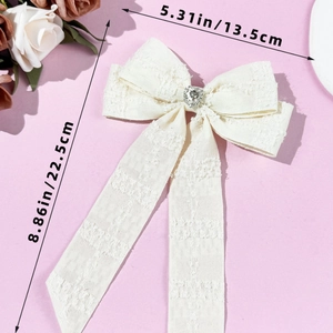 Size chart showing dimensions of the cream tweed bow hair clip with rhinestone heart