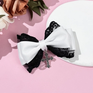 Gothic cross pendant on black lace and white satin bow hairpin detail for women