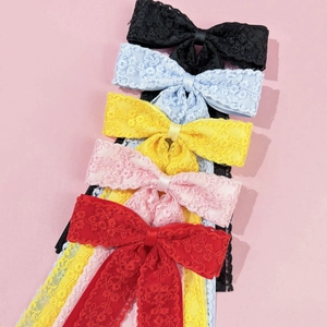 Elegant lace bow hair clips in five colors including black and red with silk ribbons