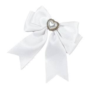 Elegant white satin ribbon bow hair clip featuring a pearlescent heart center ornament