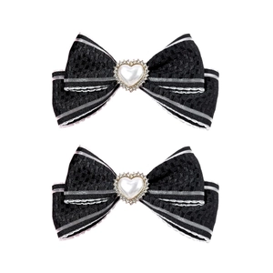 Lot de 2 barrettes nœud noir élégantes avec perle de cœur et bords à rayures blanches