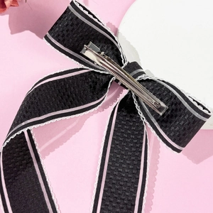 Elegant bow hair clip with pink stripes, white lace edges, and silver metal duckbill clip