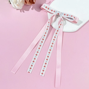 Pink ribbon hair clip with embroidered heart and flower patterns in a sweet style