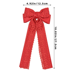 Detailed size view of red satin and lace bow hair clip with elegant long streamers