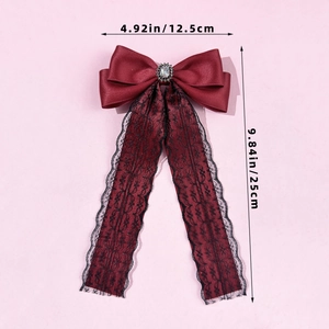 Detailed view of dark red lace bow hair clip measuring 12.5cm width and 25cm length