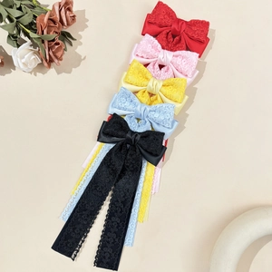 Elegant lace bow hair clips with long ribbon streamers in five vibrant colors