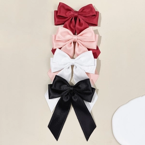 Elegant lace bow hair clips set in burgundy, pink, white, and black satin fabric